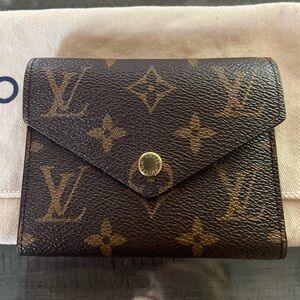 Louis Vuitton New Authentic Victorine Mono wallet. Made In France. New condition